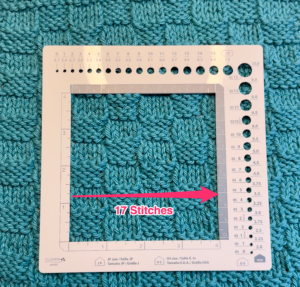 Knit dishcloth with a gauge ruler to demonstrate number of stitches over 4 inches